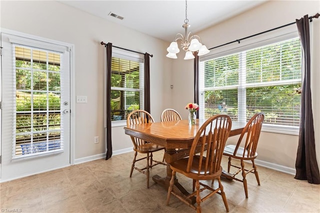 822 Blue Lake Dr, Mebane, NC 27302 - dining space with a chandelier and healthy amount of natural light