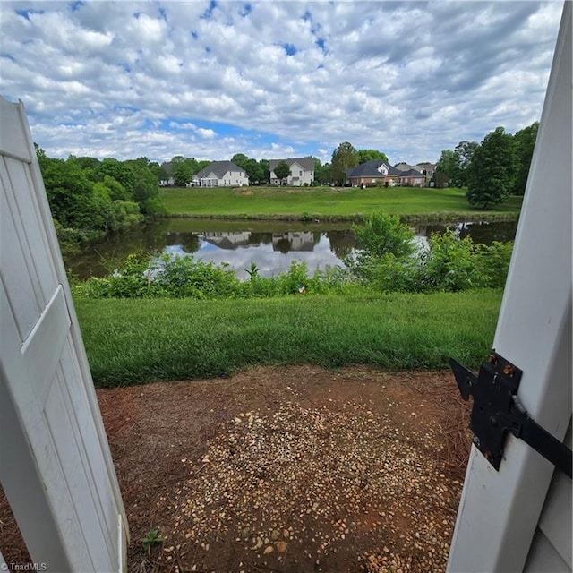 exterior space with a water view