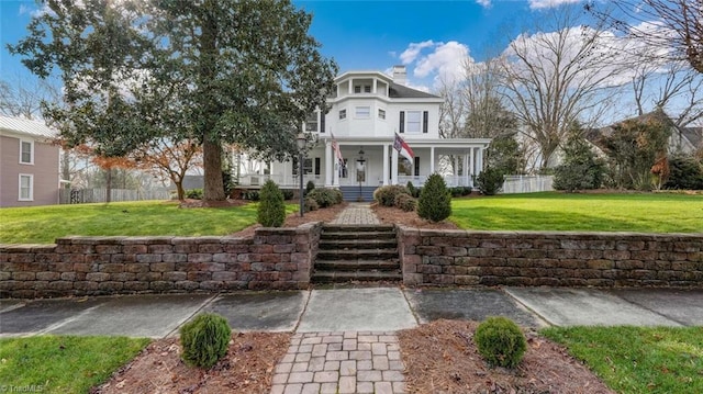 view of front of home featuring a front lawn and a porch