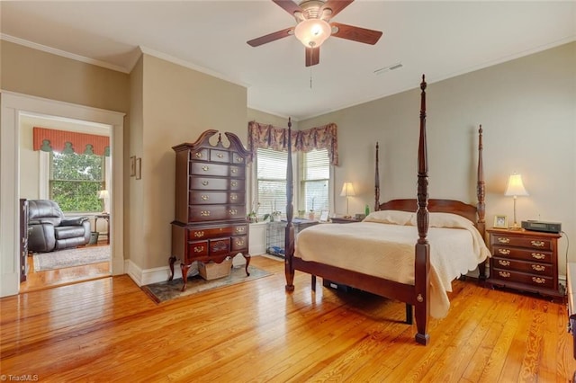 bedroom featuring multiple windows, ceiling fan, crown molding, and light hardwood / wood-style floors