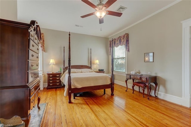 bedroom featuring ceiling fan, wood-type flooring, and crown molding