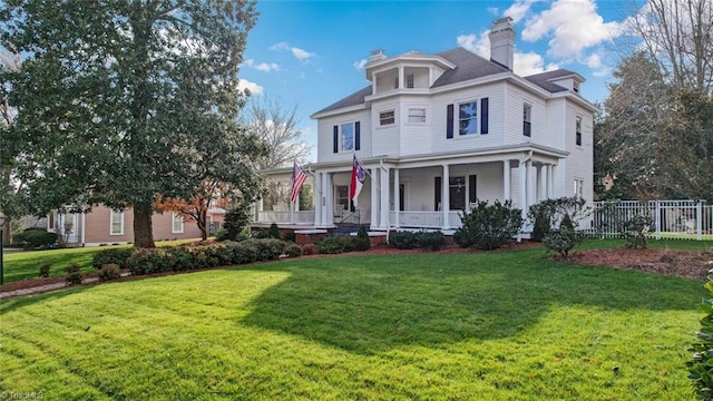 view of front facade with a porch and a front yard