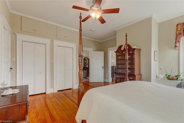 bedroom with hardwood / wood-style floors, ceiling fan, and crown molding