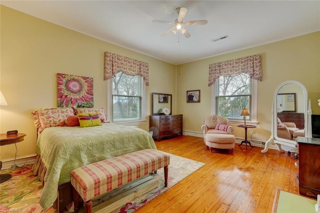 bedroom with ceiling fan and light hardwood / wood-style floors