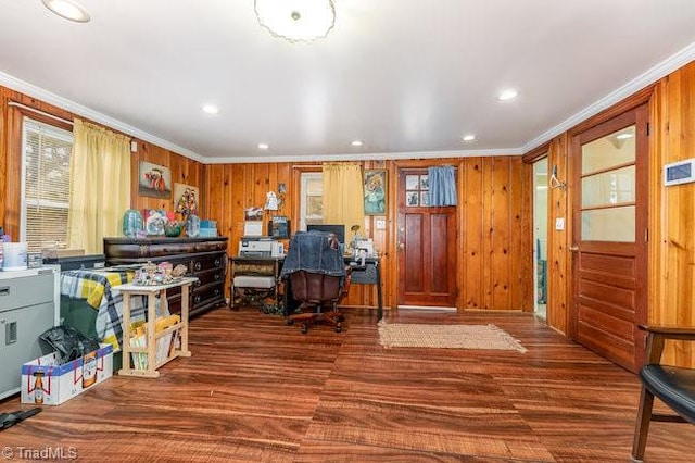 office area with crown molding, dark hardwood / wood-style flooring, and wood walls