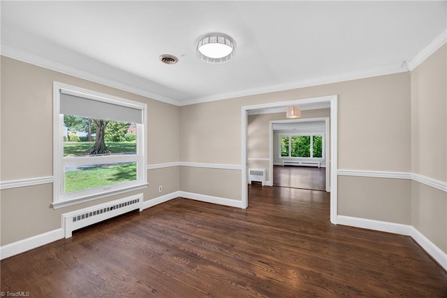 503 Tarleton Ave, Burlington, NC 27215 - spare room with radiator heating unit, ornamental molding, wood finished floors, and a baseboard radiator