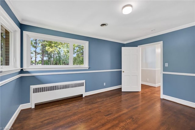 503 Tarleton Ave, Burlington, NC 27215 - spare room featuring radiator heating unit, wood finished floors, and crown molding
