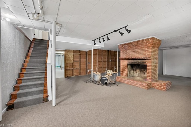 503 Tarleton Ave, Burlington, NC 27215 - unfurnished living room with carpet flooring, stairway, track lighting, and a fireplace