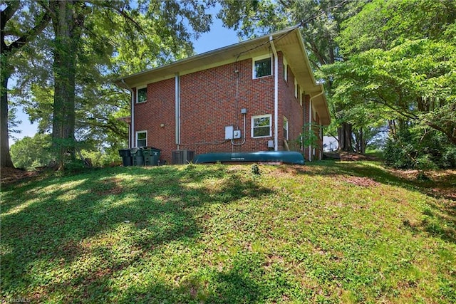503 Tarleton Ave, Burlington, NC 27215 - rear view of property featuring brick siding and a lawn