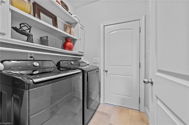 653 Piedmont Crossing Dr, High Point, NC 27265 - laundry area featuring cabinet space and washer and clothes dryer