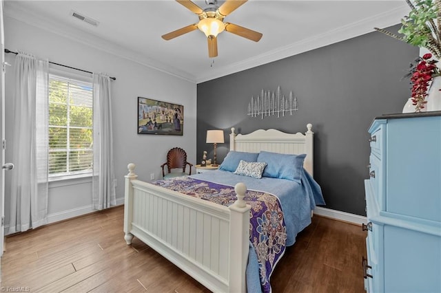 653 Piedmont Crossing Dr, High Point, NC 27265 - bedroom featuring crown molding, wood finished floors, and a ceiling fan