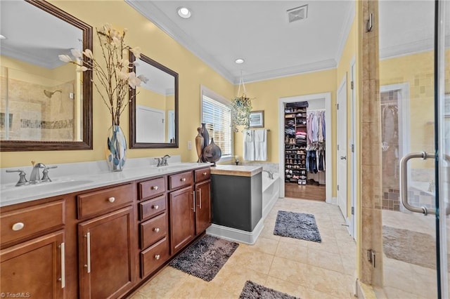 653 Piedmont Crossing Dr, High Point, NC 27265 - bathroom featuring ornamental molding, a shower stall, double vanity, a spacious closet, and tile patterned flooring