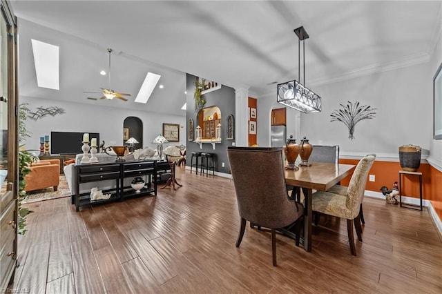 653 Piedmont Crossing Dr, High Point, NC 27265 - dining space featuring a skylight, wood finished floors, crown molding, ceiling fan, and vaulted ceiling