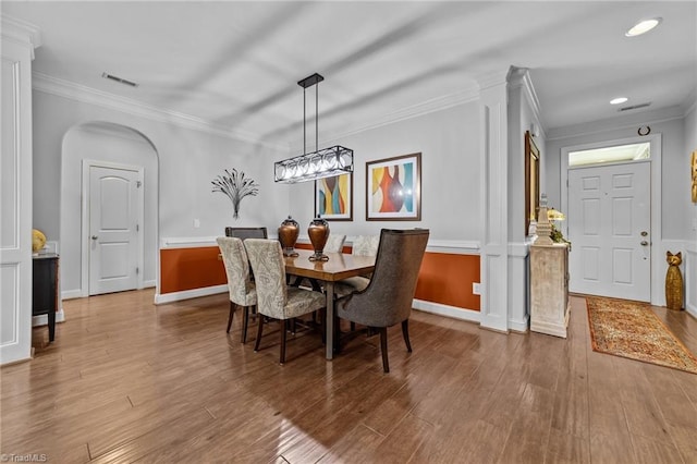 653 Piedmont Crossing Dr, High Point, NC 27265 - dining room with wood finished floors, arched walkways, ornamental molding, and recessed lighting