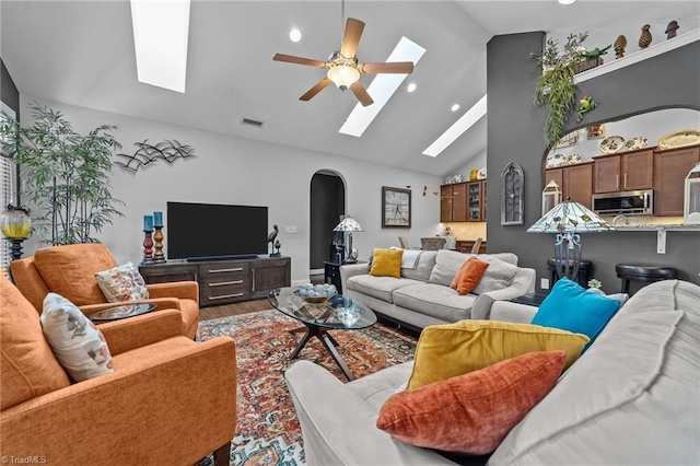 653 Piedmont Crossing Dr, High Point, NC 27265 - living area featuring a skylight, recessed lighting, a ceiling fan, wood finished floors, and arched walkways