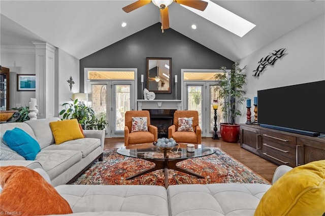 653 Piedmont Crossing Dr, High Point, NC 27265 - living area with ceiling fan, wood finished floors, high vaulted ceiling, a skylight, and recessed lighting