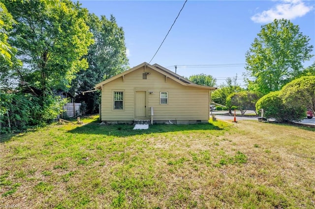 1821 Johnson St, High Point, NC 27262 - rear view of house featuring fence, a yard, crawl space, and entry steps