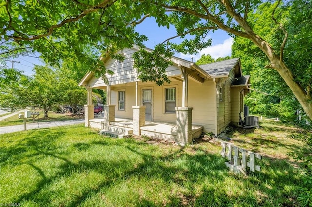 1821 Johnson St, High Point, NC 27262 - exterior space with covered porch, central AC unit, and a front lawn