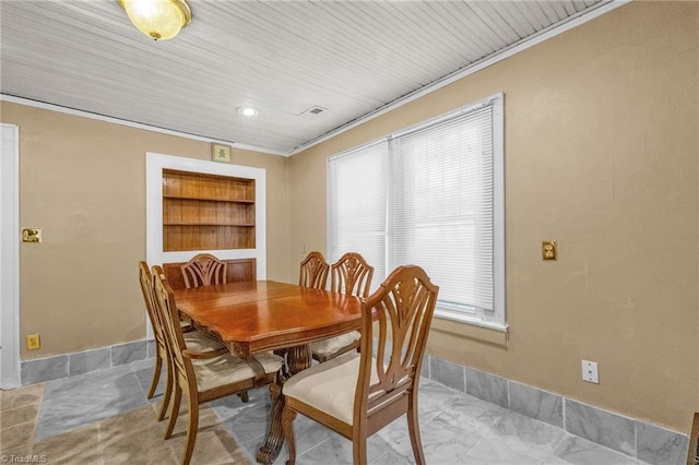 1821 Johnson St, High Point, NC 27262 - dining room featuring crown molding, baseboards, and built in shelves