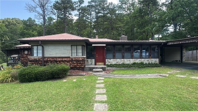113 Ridgeway Dr, Thomasville, NC 27360 - view of front of property featuring stone siding, a chimney, a carport, a front yard, and a metal roof