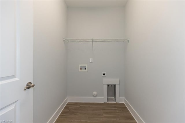 laundry room with hookup for an electric dryer, hookup for a washing machine, baseboards, dark wood-type flooring, and laundry area