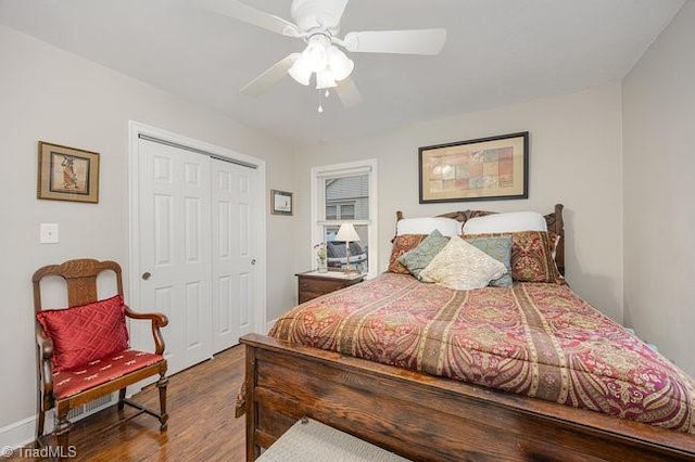 bedroom featuring ceiling fan, hardwood / wood-style floors, and a closet