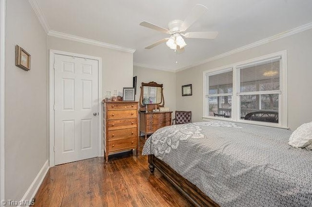 bedroom featuring crown molding, dark wood-type flooring, and ceiling fan