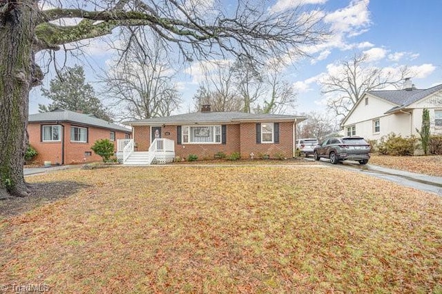 ranch-style house with a front lawn