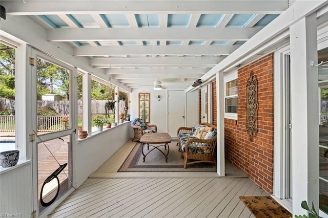 sunroom / solarium with ceiling fan