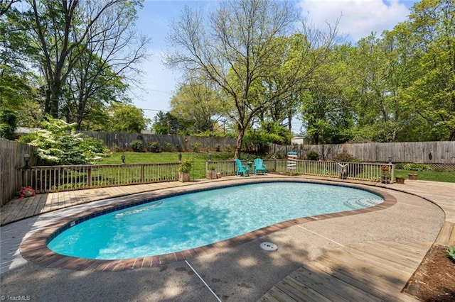 view of pool with a fenced backyard and a patio