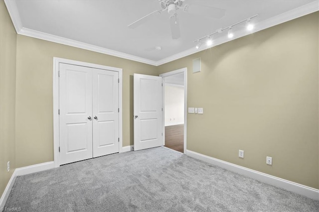 6832 Main St Unit 226, Wilmington, NC 28405 - unfurnished bedroom with track lighting, carpet, ornamental molding, a closet, and ceiling fan