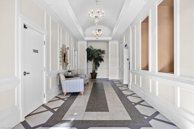 6832 Main St Unit 226, Wilmington, NC 28405 - hall with inlaid floor details, a chandelier, lofted ceiling, a decorative wall, and ornamental molding