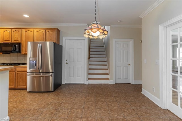 8105 Summit Springs Ct, Browns Summit, NC 27214 - kitchen with stainless steel fridge, black microwave, crown molding, tasteful backsplash, and pendant lighting