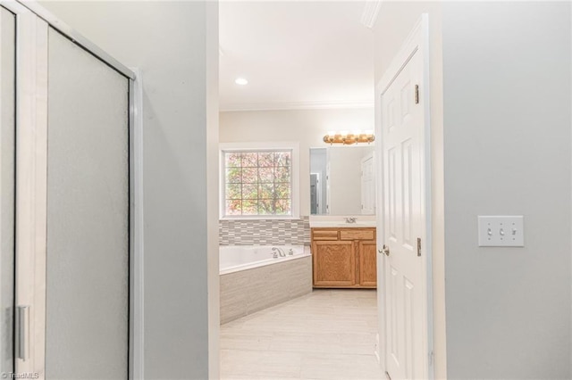 8105 Summit Springs Ct, Browns Summit, NC 27214 - full bathroom featuring vanity, a bath, crown molding, a shower stall, and recessed lighting