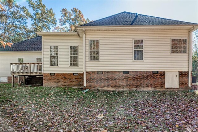 8105 Summit Springs Ct, Browns Summit, NC 27214 - rear view of property featuring crawl space, a deck, roof with shingles, and a lawn