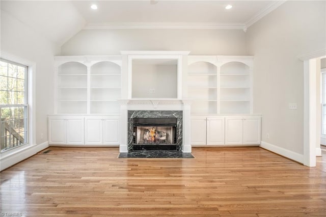 8105 Summit Springs Ct, Browns Summit, NC 27214 - unfurnished living room featuring a fireplace, light wood-style floors, recessed lighting, baseboards, and crown molding