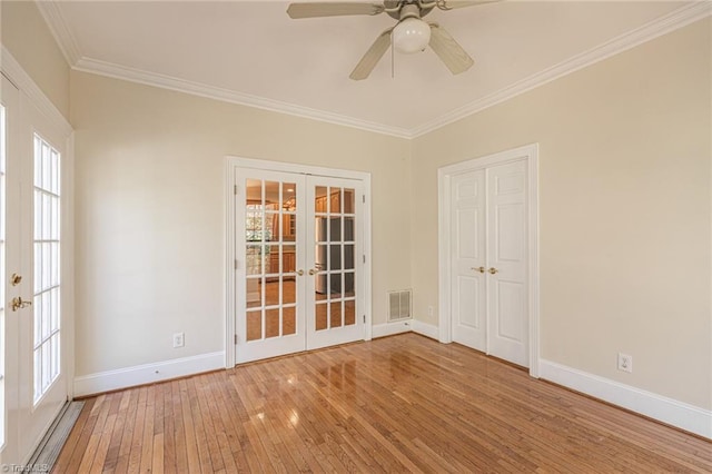 8105 Summit Springs Ct, Browns Summit, NC 27214 - empty room featuring french doors, light wood-style flooring, ornamental molding, baseboards, and a ceiling fan