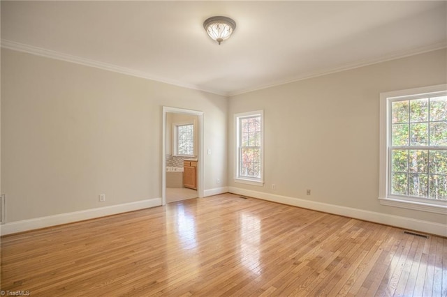 8105 Summit Springs Ct, Browns Summit, NC 27214 - unfurnished room with baseboards, light wood finished floors, and crown molding