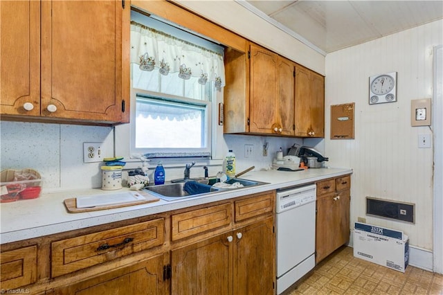 2405 Ellington St, Greensboro, NC 27403 - kitchen with white dishwasher, brown cabinetry, and light countertops