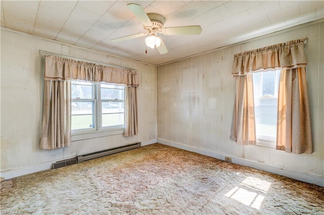 2405 Ellington St, Greensboro, NC 27403 - spare room featuring baseboard heating, carpet flooring, and a ceiling fan