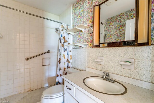 2405 Ellington St, Greensboro, NC 27403 - full bathroom with a shower with curtain, vanity, and wallpapered walls