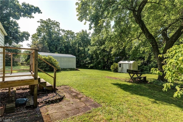 2405 Ellington St, Greensboro, NC 27403 - view of green lawn featuring a shed