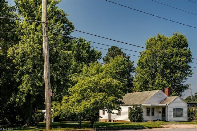 2405 Ellington St, Greensboro, NC 27403 - view of front of home with a chimney and a shingled roof