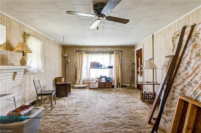 2405 Ellington St, Greensboro, NC 27403 - living area featuring carpet, a ceiling fan, crown molding, and wooden walls