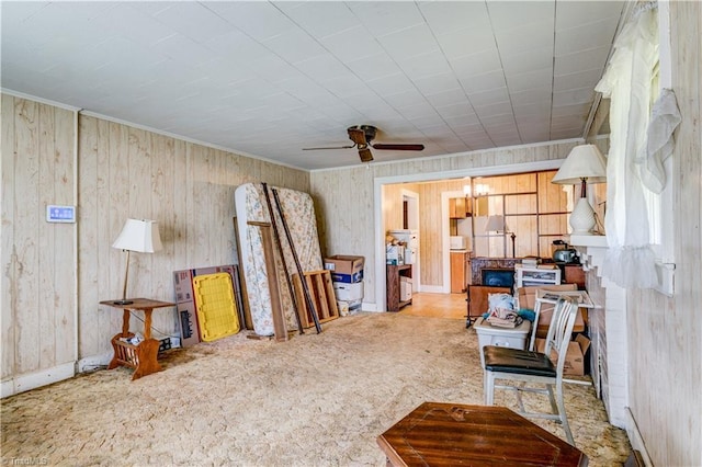 2405 Ellington St, Greensboro, NC 27403 - sitting room featuring a ceiling fan, wood walls, carpet, and crown molding