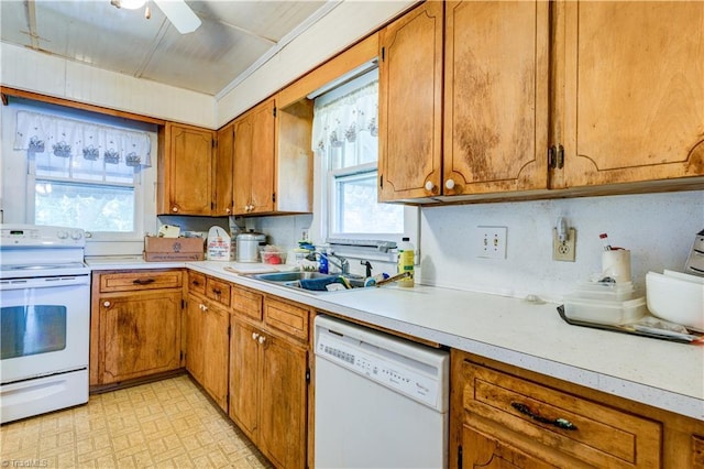 2405 Ellington St, Greensboro, NC 27403 - kitchen with white appliances, brown cabinetry, light countertops, and ceiling fan