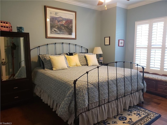 bedroom featuring crown molding, dark hardwood / wood-style flooring, and multiple windows