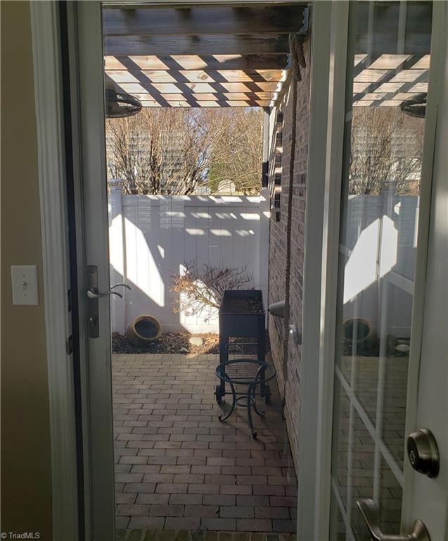 doorway with brick floor