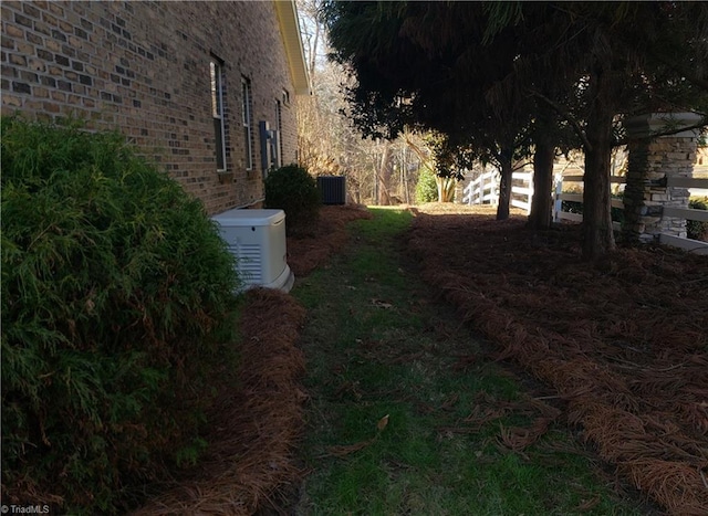 view of yard featuring central AC unit