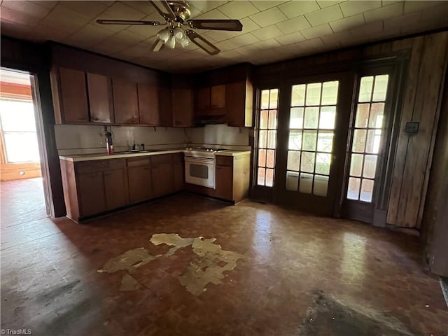 kitchen featuring light countertops, ceiling fan, and a wealth of natural light